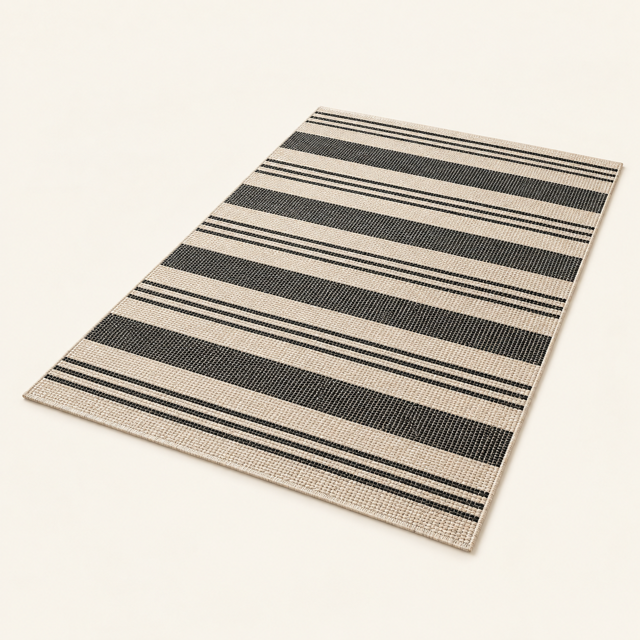 AI illustration representing Fab Habitat Cancun Shadow outdoor rug — Sand/Black, 5 × 8 ft